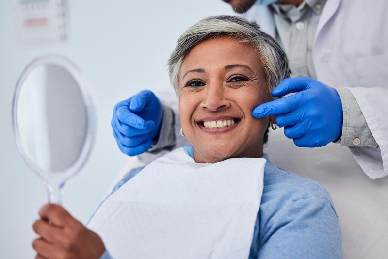 Older woman at the dentist smiling